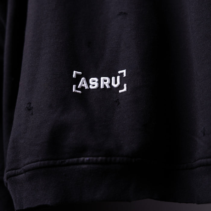 FA'20 Distressed Hoodie in black, close-up detail of ASRU logo embroidery on chest