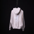 FA'22 Tech Terry Eagle Hoodie in cream, hung on chain against black background