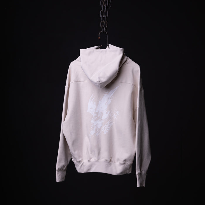 FA'22 Tech Terry Eagle Hoodie in cream, hung on chain against black background