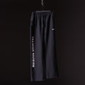 FA'23 Straight Leg Jogger in black, displayed on hanger against dark background
