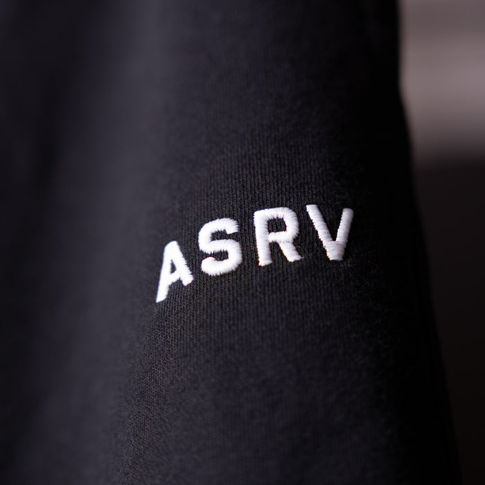 FA'23 Straight Leg Jogger in black, closeup of ASRV logo on fabric
