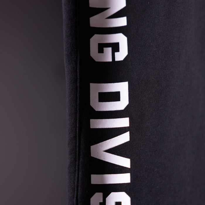 FA'23 Straight Leg Jogger in black with white branding, detail shot of side seam text