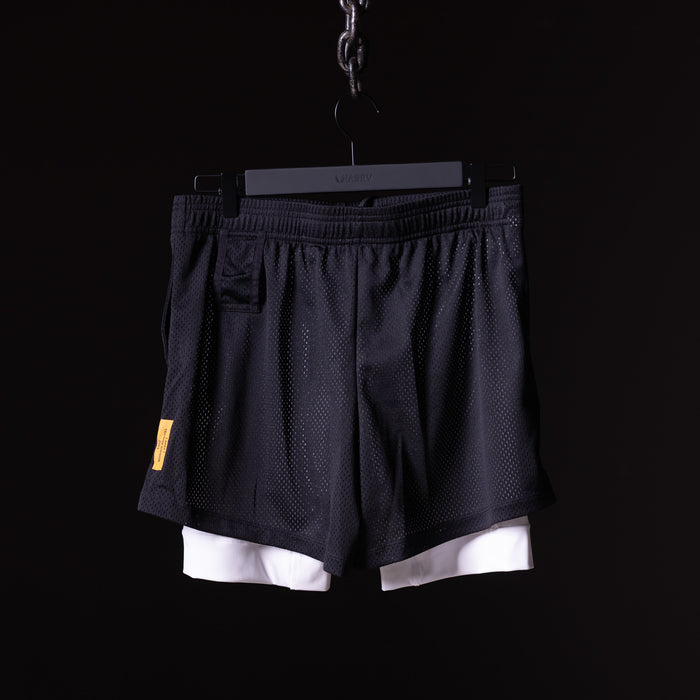 flatlay Training Division Mesh Shorts in black with white cuff, front view