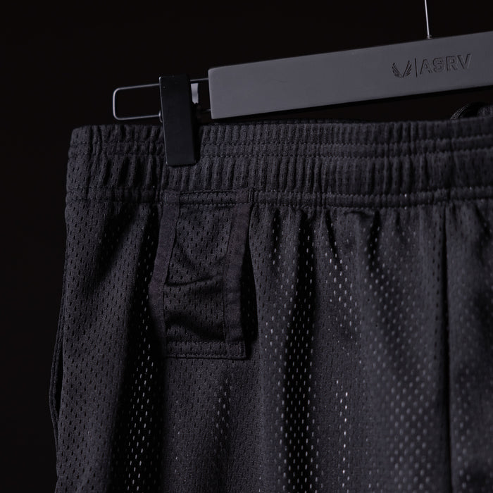 FA'23 Training Division Mesh Shorts in black on hanger, detail view