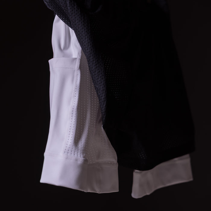 FA'23 Training Division Mesh Shorts in white and black, side view on model