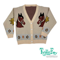 Knitted cardigan with horse designs on a white background, branded 'The Twisted Filly'.