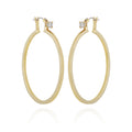 The Vince Camuto Goldtone Cubic Zirconia Large Hoops Earrings feature a pair of large, oval-shaped gold-tone hoops with small stud closures, displayed on a white background.