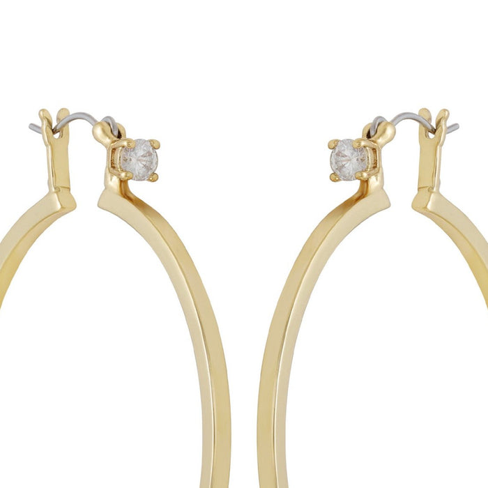 Here is your rewritten sentence using the provided product data: Close-up view of the Vince Camuto Goldtone Cubic Zirconia Large Hoops Earrings, each featuring a single round cubic zirconia set at the top. The large hoop earrings are displayed against a white background.
