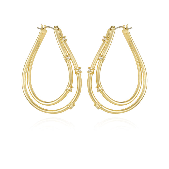 Goldtone Double Oval Hoop Earrings by Vince Camuto, featuring double curved bands and small round crystal stations, displayed on a white background for a chic and elegant look.