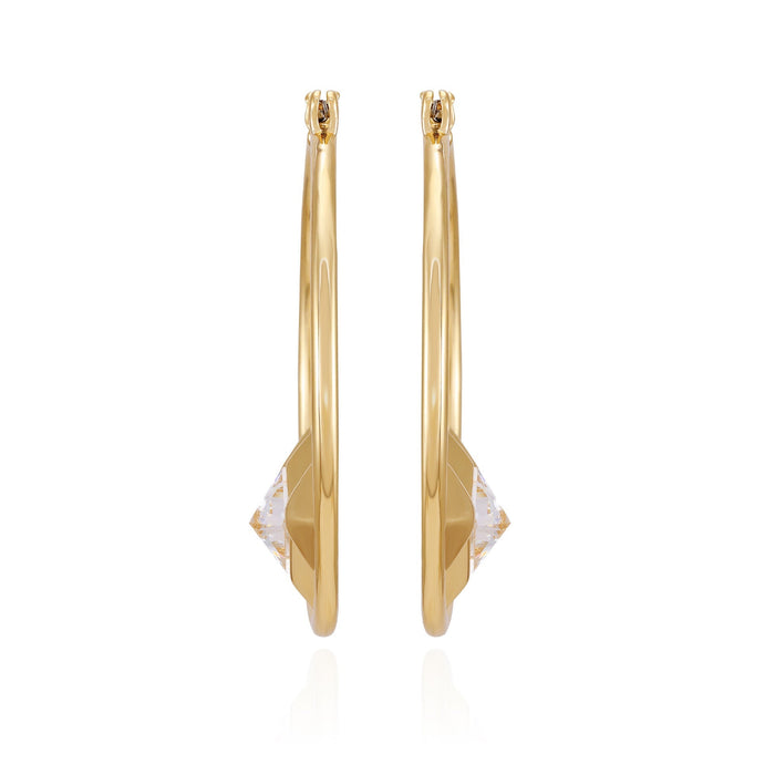 A pair of Goldtone Floating Crystal Hoop Earrings by Vince Camuto, showcasing a faceted clear gemstone accent at the base on a sleek goldtone band, displayed upright against a white background.