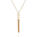The Vince Camuto Goldtone Long Tassel Chain Necklace features three stacked, cone-shaped pendants and multiple gold chains that cascade in an elegant tassel design, presented against a plain white background. This statement accessory infuses any outfit with a touch of sophistication.