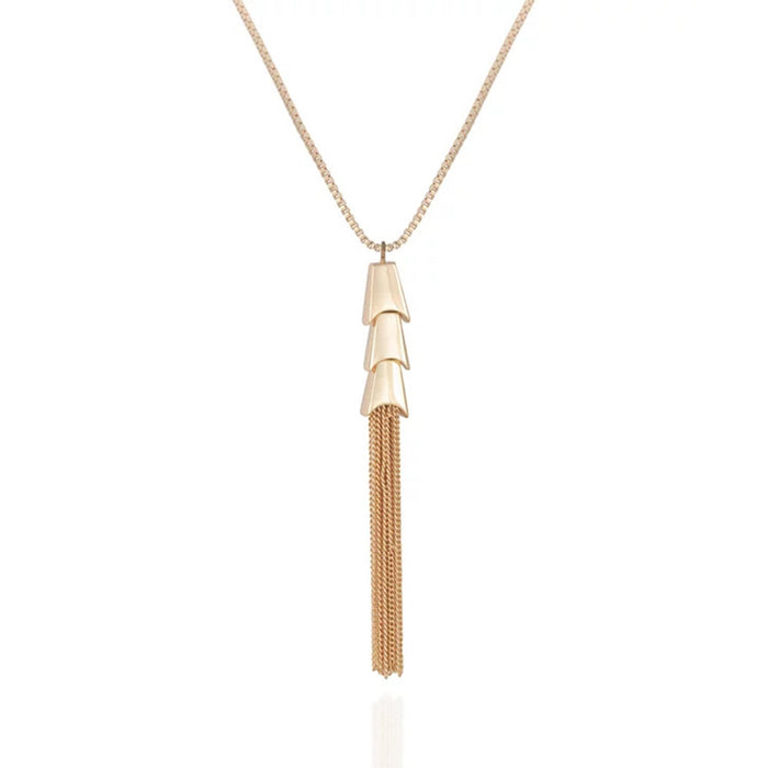 The Vince Camuto Goldtone Long Tassel Chain Necklace features three stacked, cone-shaped pendants and multiple gold chains that cascade in an elegant tassel design, presented against a plain white background. This statement accessory infuses any outfit with a touch of sophistication.