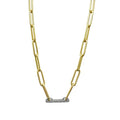 Vince Camuto’s Goldtone Pave Bar Chain Necklace features a gold paperclip chain with a horizontal, oval-shaped silver-toned pendant at the center, embellished with small sparkling stones, and is displayed on a white background for a sophisticated look.
