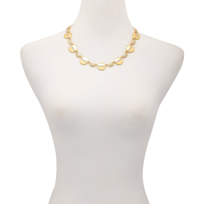The Vince Camuto Goldtone Pave Multi-Coin Statement Necklace features a gold adjustable chain adorned with round, flat discs reminiscent of classic coins, elegantly displayed on a white mannequin bust.