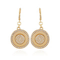 Introducing the Goldtone Pave Stone Coin Drop Earrings by Vince Camuto, inspired by classic French coin designs. These earrings showcase circular pendants adorned with two concentric rows of small clear glass pave stones and a central cluster of matching stones, beautifully displayed against a white background.