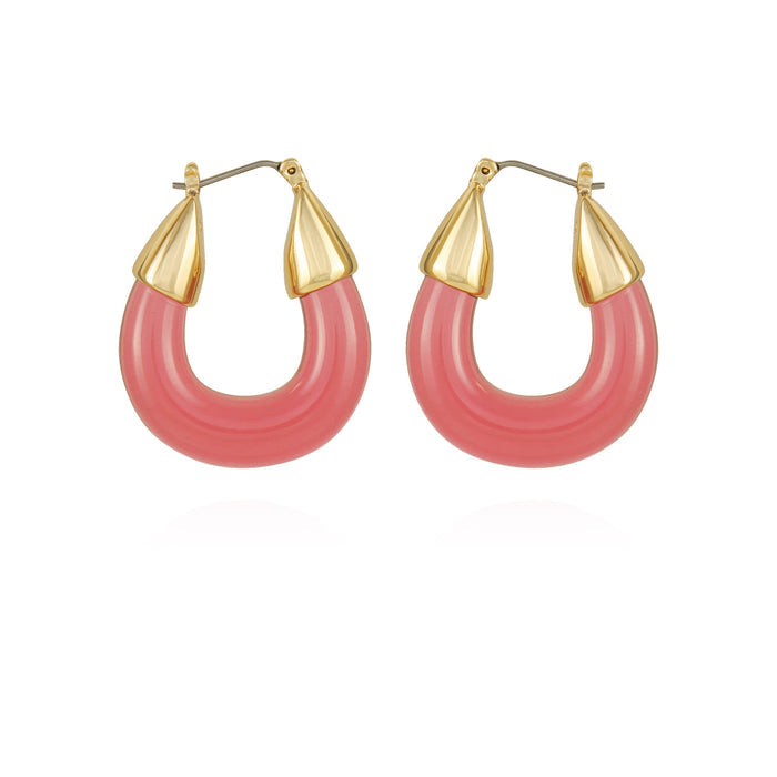 The Vince Camuto Goldtone Pink Candy Hoop Earrings feature thick, rounded pink resin hoops topped with gold-tone pointed caps, displayed on a white background.