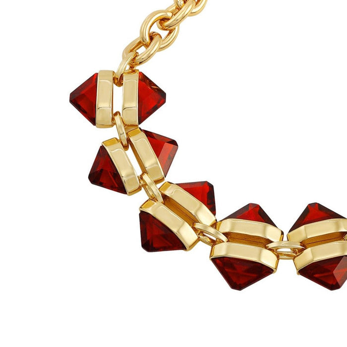 Showcasing the Goldtone Red Stone Cable Chain Bracelet by Vince Camuto, this piece features geometric, deep red resin stones set in a repeating pattern along a gleaming gold cable chain. The elegant gold links connect the bold, angular stones for a chic and striking accessory—perfect to elevate any ensemble.