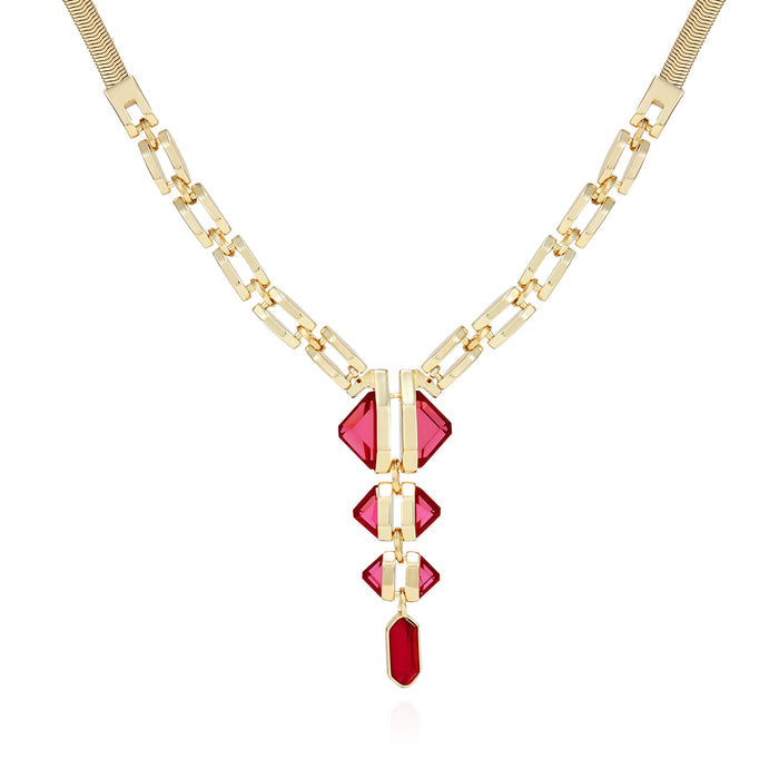 The Vince Camuto Goldtone Red Stone Pendant Statement Necklace showcases a modern, symmetrical design with a geometric snake chain and four vertically graduated red resin stone pendants set in gold. The striking, bold necklace is photographed against a white background for an eye-catching presentation.