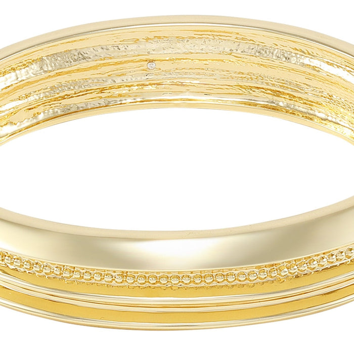 Showcasing its intricate and shiny design, the Vince Camuto Goldtone Textured Hinge Bracelet features a polished goldtone finish with a hammered upper edge and a central row of small gold beads.