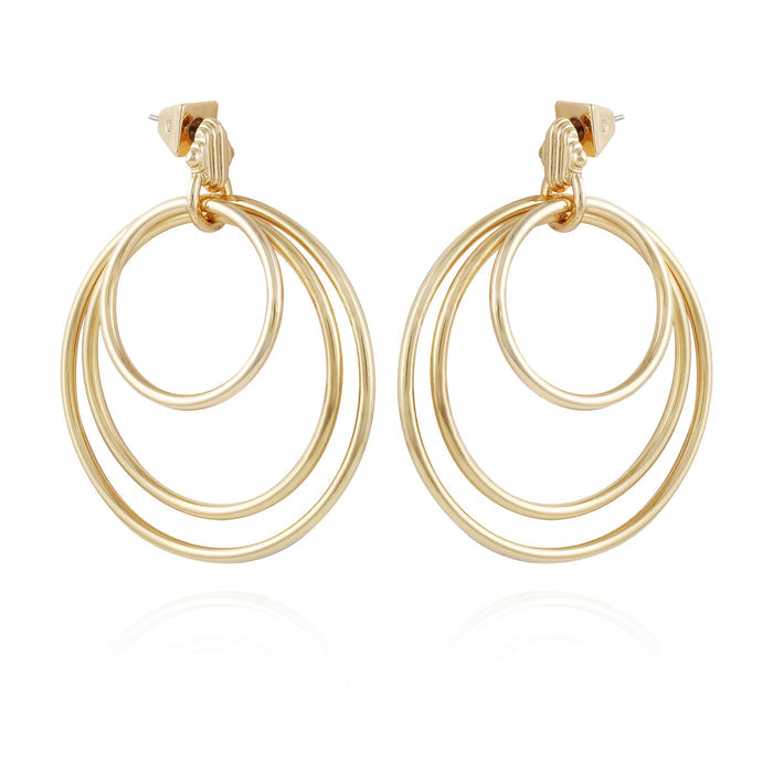 Goldtone Triple Layered Hoop Drop Earrings by Vince Camuto featuring three interlocking open hoops in a circular design, with stud posts at the top, displayed on a white background.