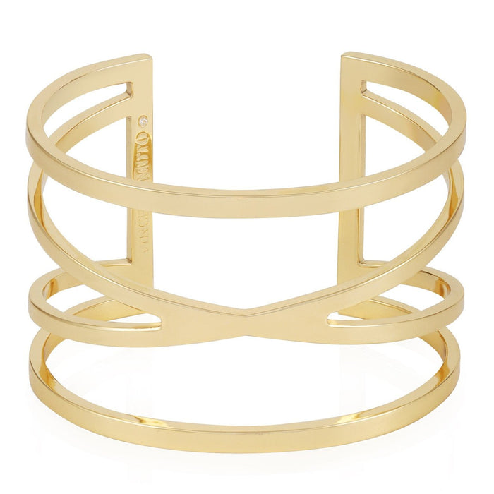 Vince Camuto’s Goldtone Twisted Double Cuff Bracelet showcases an open geometric design with overlapping curved and straight bars, beautifully displayed on a white background.