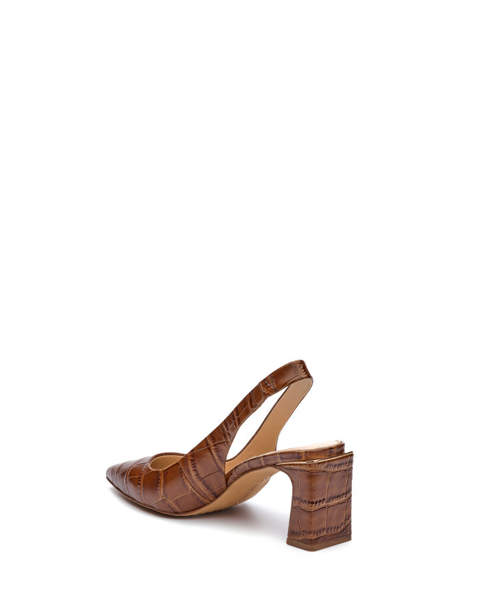 The Vince Camuto Hamden Slingback is a brown, crocodile-patterned leather slingback featuring a pointed toe and mid-height block heel, displayed at an angle against a plain white background.