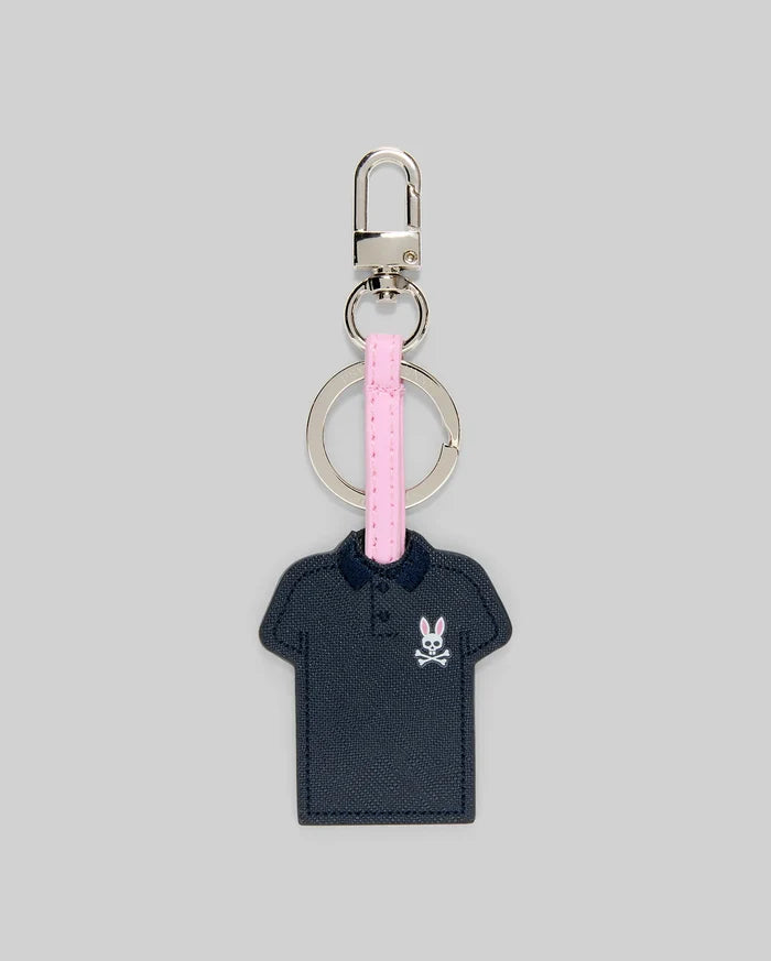 Iconic Polo Keychain featuring a navy blue textured faux leather polo shape with a small pink and white Psycho Bunny skull logo on the left chest, attached to a pink strap and silver metal hardware.