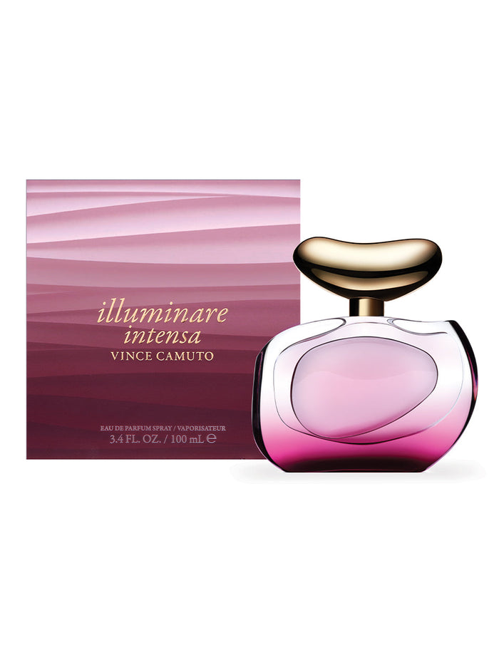 A bottle of Vince Camuto Illuminare Intensa 3.4 oz Eau de Parfum Spray rests in front of its matching pink and gold gradient box. The clear bottle, tinged with pink and topped by an abstract-shaped gold cap, beautifully reflects the sensual blend characteristic of this voluptuous fragrance.
