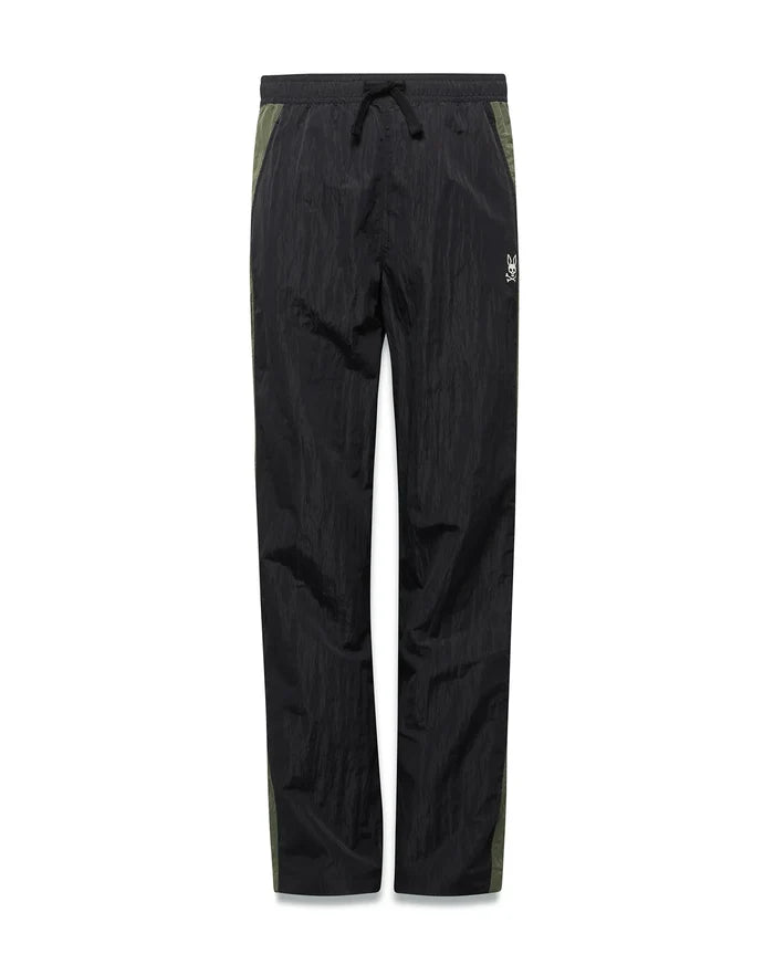 Kids Alder Nylon Colorblock Pant in black crinkled nylon with olive green side panels, featuring a relaxed fit and a small white Psycho Bunny skull logo on the right hip.