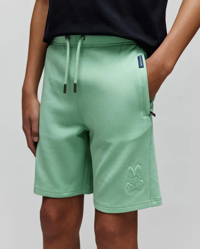Mint Green Kids Barry Modal Short, relaxed fit, soft french terry fabric, drawstring waist with dark grey tips, small Psycho Bunny tag on right pocket, and large tonal embroidered bunny skull logo on left leg.