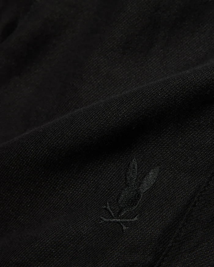 Kids Brad Linen Short in classic black, crafted from a breathable linen blend with a subtle woven texture, featuring a small, tonal embroidered Psycho Bunny skull logo.