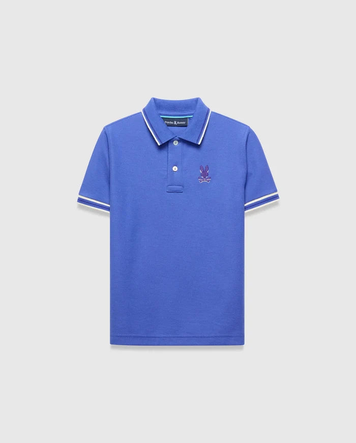 Kids Brad Pique Polo, royal blue classic fit pique polo with white tipped collar and cuffs, featuring a small embroidered purple Psycho Bunny skull logo on the left chest.