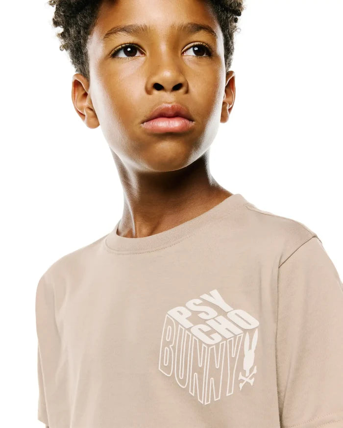 Kids Conan Back Graphic Tee in beige, featuring a classic fit and a large white 3D-effect PSYCHO BUNNY text graphic with the iconic bunny skull logo on the smooth jersey knit front.