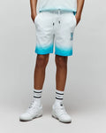 Kids Dax Sweatshort, white to blue ombre french terry with a relaxed fit and an embroidered blue Psycho Bunny skull logo on the left thigh.