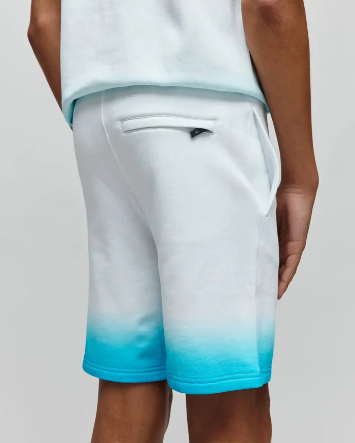 Kids Dax Sweatshort in soft french terry, featuring a white to vibrant turquoise ombre fade, relaxed fit, and a small black Psycho Bunny logo tag on the rear welt pocket.