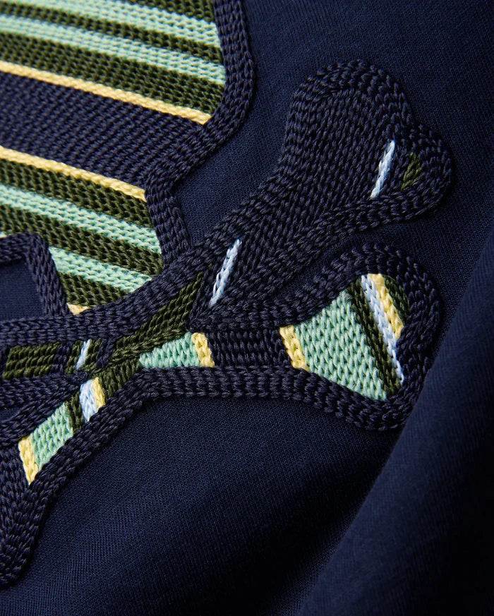 Kids Drew Embroidered Graphic Tee in classic navy jersey, showcasing a large, intricately textured graphic with bold green, yellow, light blue, and white striped embroidery.