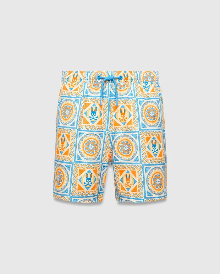 Kids Frank Swim Trunk with a vibrant white, orange, and blue tiled pattern, featuring the iconic Psycho Bunny skull logo and intricate floral designs, finished with a blue drawstring.