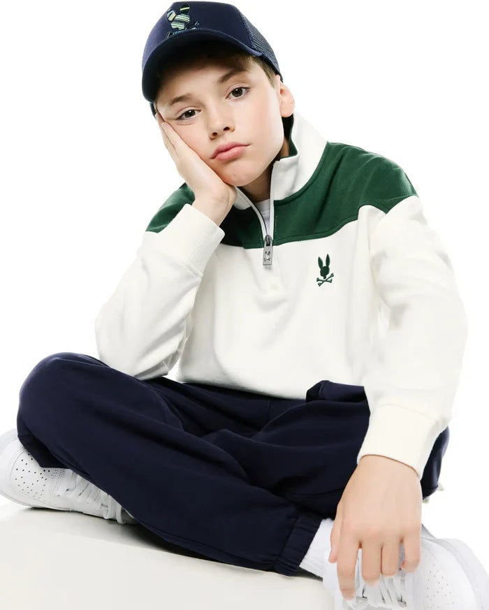 Kids Gabe French Terry 1/4 Zip, a cream and forest green color-block pullover with a custom Psycho Bunny zipper, relaxed fit, ribbed cuffs, and an embroidered green logo on the left chest.