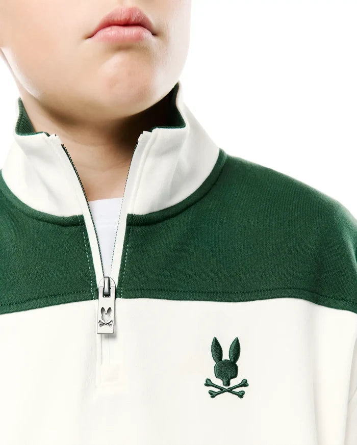 Kids Gabe French Terry 1/4 Zip, color-blocked in dark green and off-white, features a quarter-zip with a branded zipper pull and an embroidered dark green Psycho Bunny skull logo on the left chest.