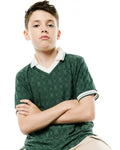 Kids Garry Jacquard Johnny Collar Polo in dark green, featuring an all-over tonal Psycho Bunny skull logo jacquard pattern, a white Johnny collar, and white striped cuffs.