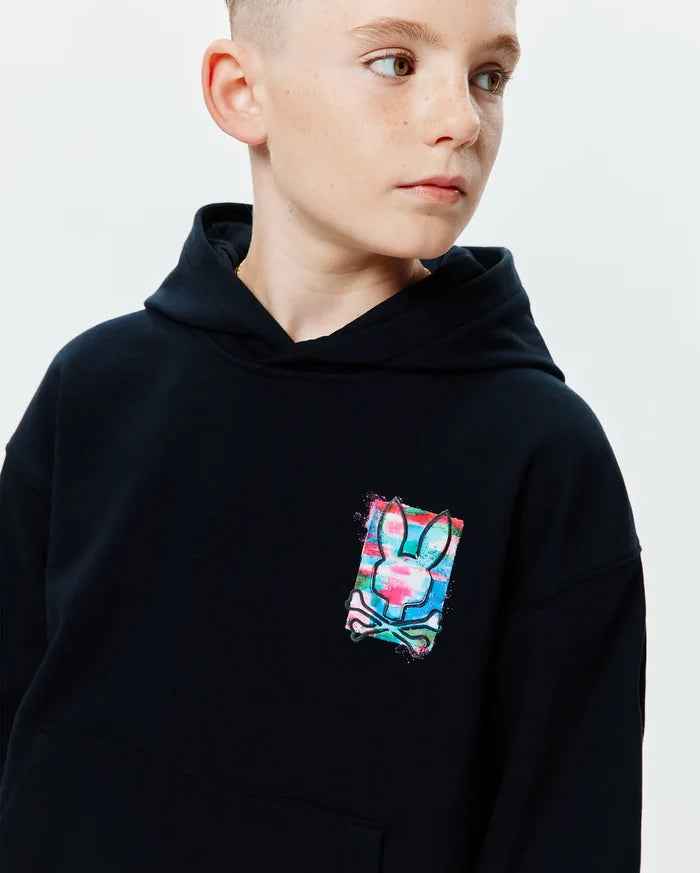 Kids Isaac Print Hoodie, black relaxed fit jersey hoodie with a small, vibrant multi-color graphic print of the Psycho Bunny skull logo on the chest, featuring pink, blue, and green splashes.