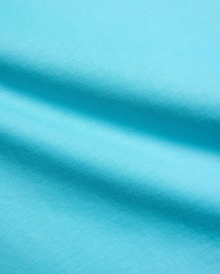 Kids Isaac Relaxed Fit Tee in vibrant aqua blue, crafted from soft jersey knit fabric, featuring the iconic small embroidered Psycho Bunny skull logo on the chest.
