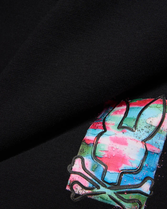 Kids Isaac Print Short in black jersey, featuring a large, vibrant Psycho Bunny skull logo with pink, blue, green, and white paint-splatter print and a raised black outline.