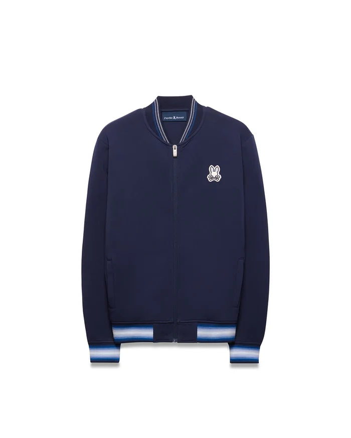 Kids Jaydon Track Jacket in navy blue, featuring a full zip, ribbed collar, and striped cuffs in white and light blue, with an embroidered Psycho Bunny skull logo on the left chest.