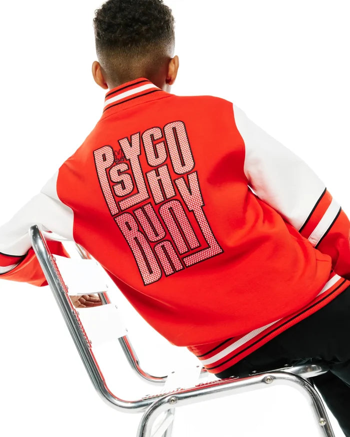 Kids Joey Knit Bomber in red with white sleeves, featuring a large Psycho Bunny text graphic on the back with a small bunny skull, and black and white striped ribbed trim.