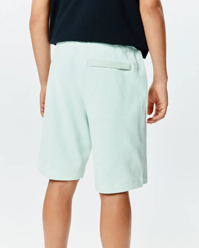 Kids Keith Short 3 1/2, a relaxed fit pale mint green pique knit short, showcasing a subtle tonal back welt pocket detail, embodying premium streetwear style.