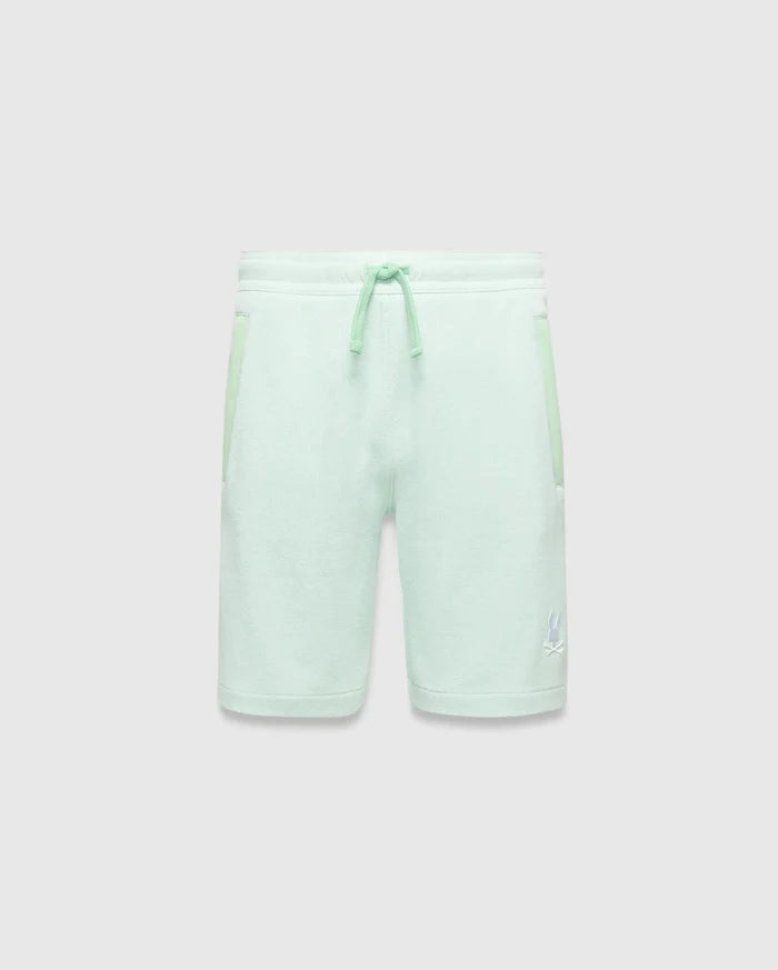 Kids Keith Short in mint green jersey knit, featuring a relaxed fit, lighter mint drawstrings, side pockets with subtle accent trim, and a small white embroidered Psycho Bunny skull logo on the lower left leg.