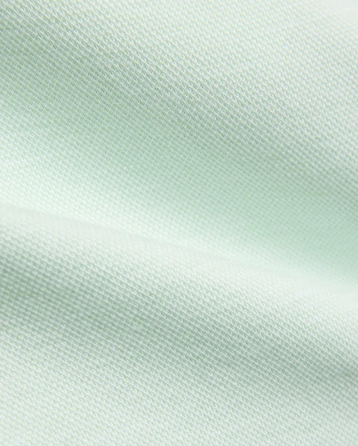 Psycho Bunny Kids Keith Short 3 1/2, crafted from a premium, breathable pale mint green pique fabric with a distinct textured weave, embodying refined streetwear comfort.