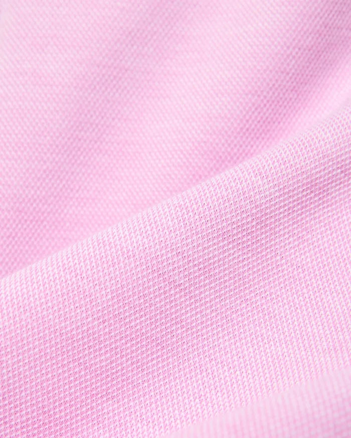 Kids Keith Short 3 1/2 crafted from a luxurious, breathable pink pique knit fabric, highlighting the refined texture and quality of Psycho Bunny's premium streetwear collection.
