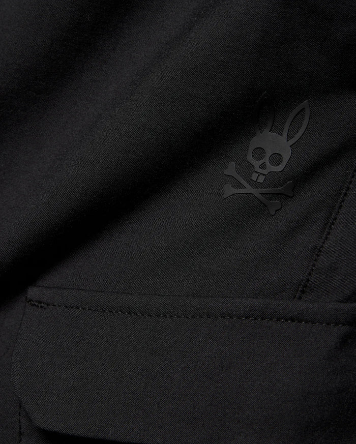 Kids Luka Cargo Pant in black woven fabric, featuring a tonal black Psycho Bunny skull and crossbones logo on the cargo pocket.